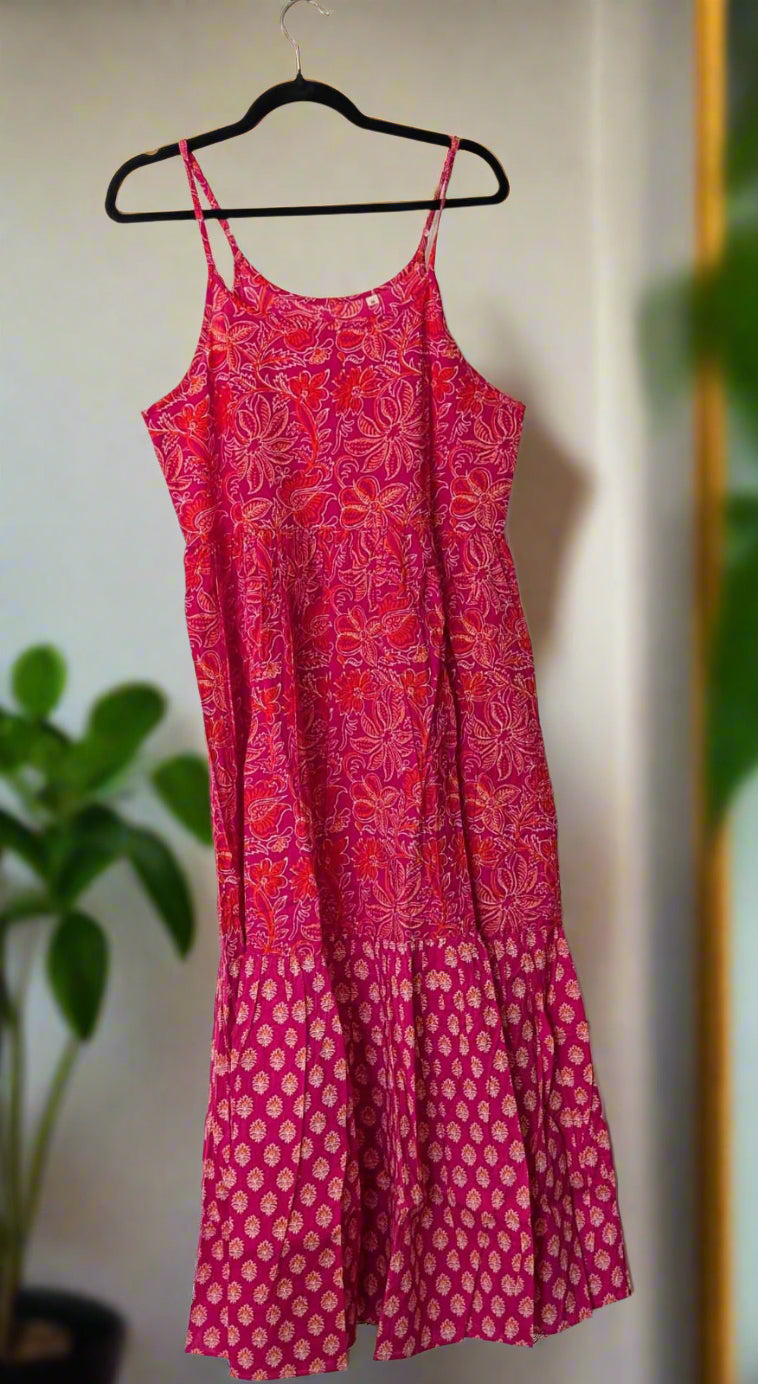 A striking red and pink floral print strap dress