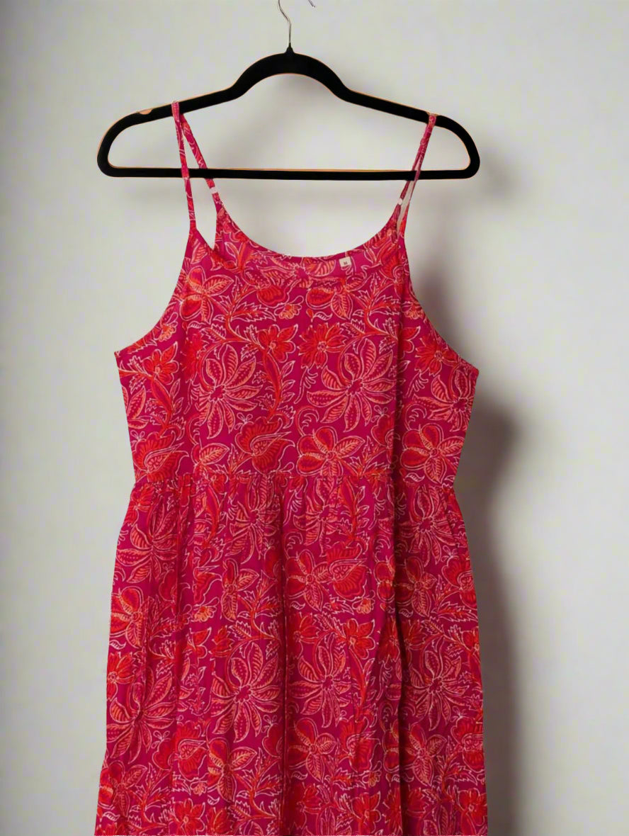 A striking red and pink floral print strap dress